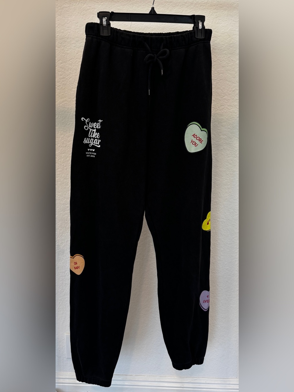 White Fox Black Sweatpants with Conversation Hearts, size Medium